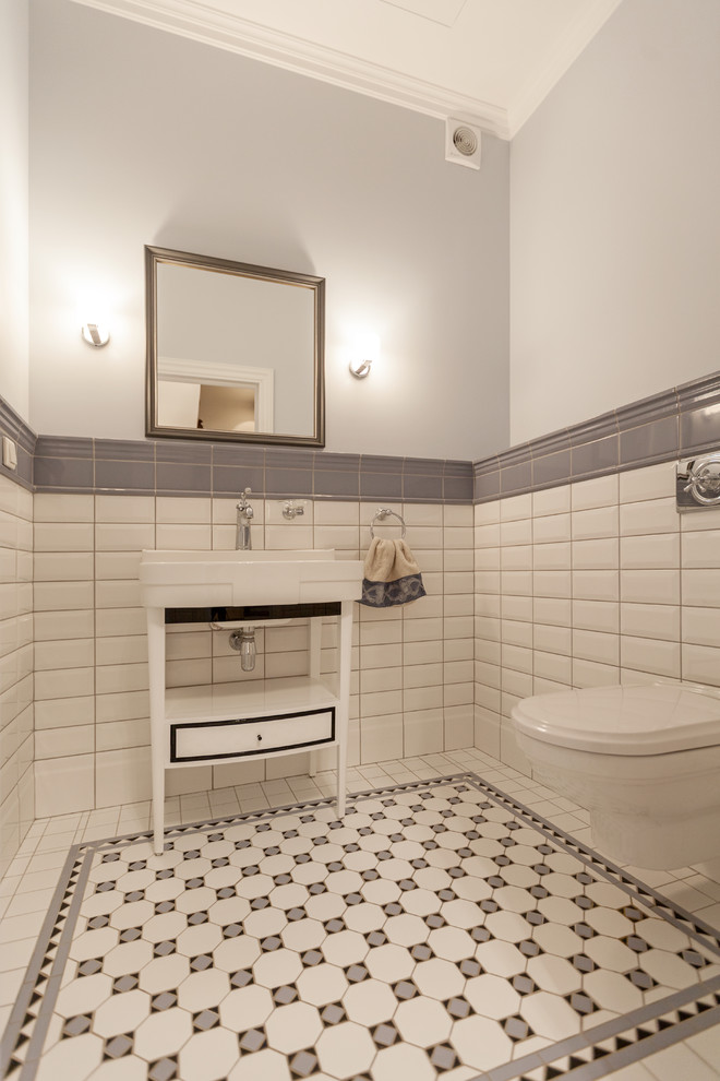 Transitional powder room in Moscow with a wall-mount toilet, white tile, gray tile, subway tile, grey walls, a console sink and multi-coloured floor.