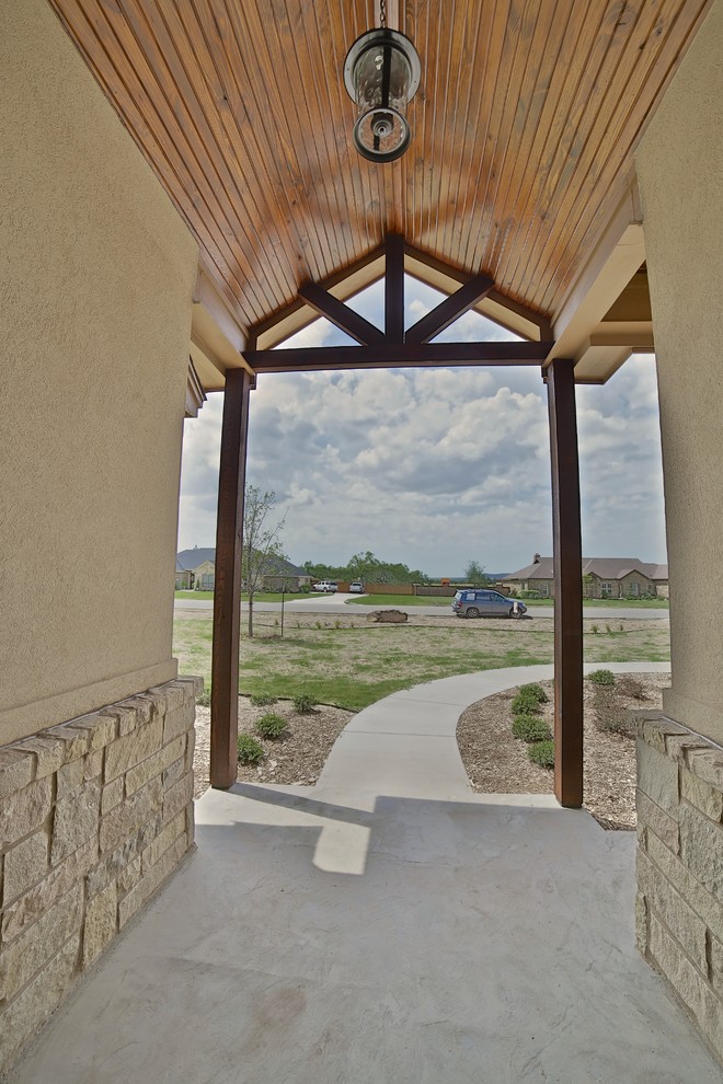 Inspiration for a mid-sized rustic concrete floor front door remodel in Dallas with metallic walls and a metal front door