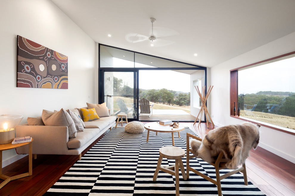This is an example of a mid-sized contemporary enclosed living room in Melbourne.