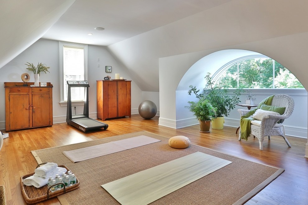 Inspiration for a traditional home yoga studio in New York with white walls.