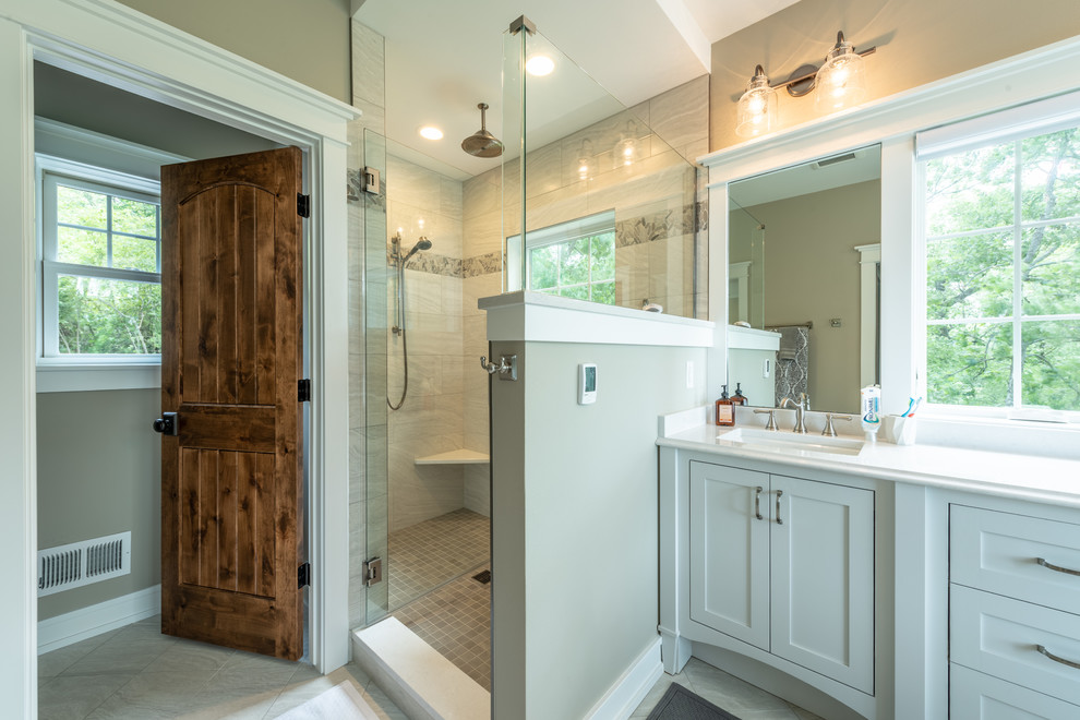 Mid-sized arts and crafts master bathroom in Milwaukee with beaded inset cabinets, grey cabinets, a claw-foot tub, a corner shower, a two-piece toilet, beige walls, ceramic floors, an undermount sink, engineered quartz benchtops, white floor, a hinged shower door and yellow benchtops.