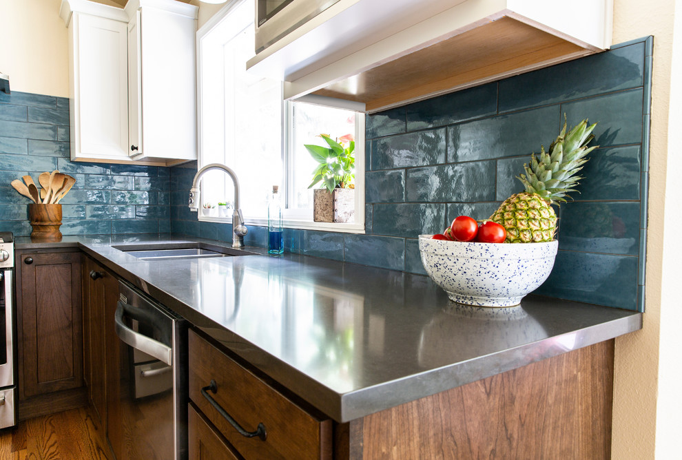 Small transitional u-shaped medium tone wood floor and brown floor kitchen pantry photo in Seattle with an undermount sink, shaker cabinets, white cabinets, quartz countertops, blue backsplash, porcelain backsplash, stainless steel appliances, no island and gray countertops