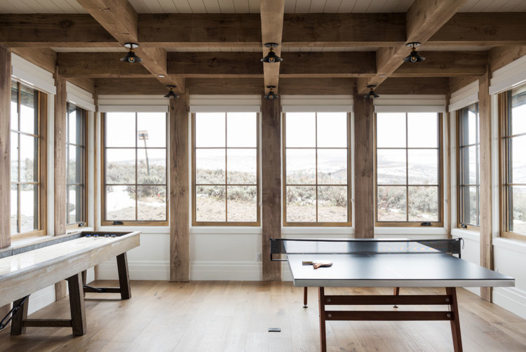 Inspiration for a large transitional enclosed medium tone wood floor and brown floor game room remodel in Salt Lake City with white walls