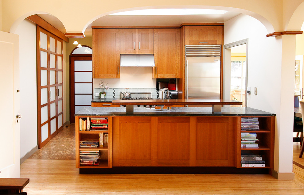 Inspiration for an asian galley kitchen in San Francisco with shaker cabinets, medium wood cabinets and stainless steel appliances.