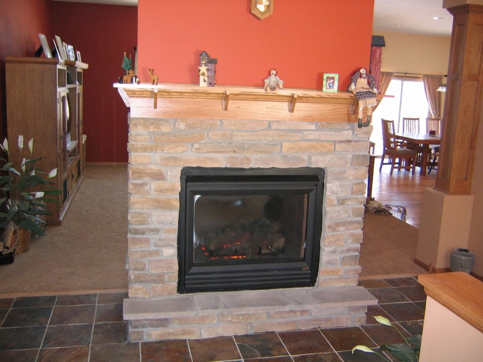 Example of a mid-sized foyer design in Minneapolis with orange walls