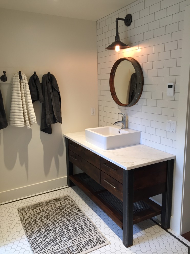 Design ideas for a mid-sized country kids bathroom in Other with flat-panel cabinets, medium wood cabinets, an alcove tub, a shower/bathtub combo, a one-piece toilet, white tile, ceramic tile, ceramic floors, a vessel sink, granite benchtops, beige walls and white floor.