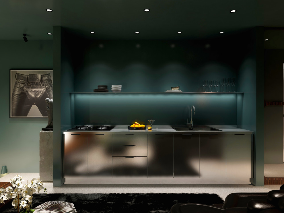 This is an example of a large modern single-wall open plan kitchen in London with carpet, beige floor, a drop-in sink, flat-panel cabinets, stainless steel cabinets, stainless steel benchtops, green splashback, stainless steel appliances, no island and grey benchtop.