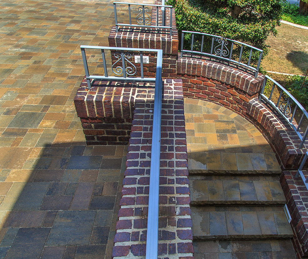Photo of a contemporary patio in Orange County with brick pavers.