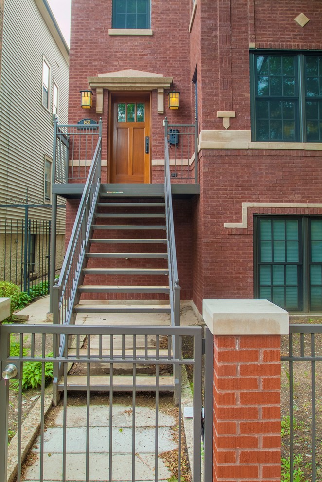 Photo of a large industrial three-storey brick red exterior in Chicago.