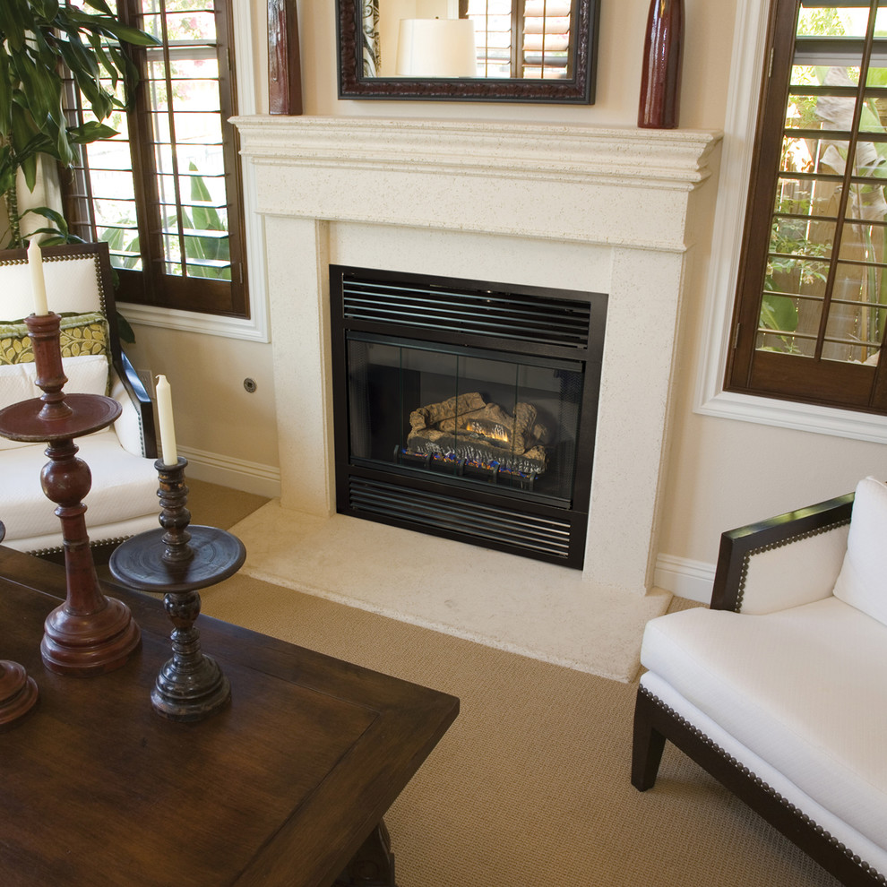 Photo of a traditional living room in Orange County with a standard fireplace.