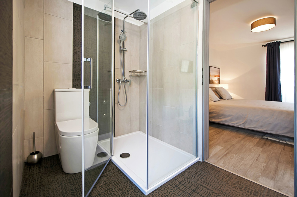 Example of a mid-sized master black and white tile black floor bathroom design