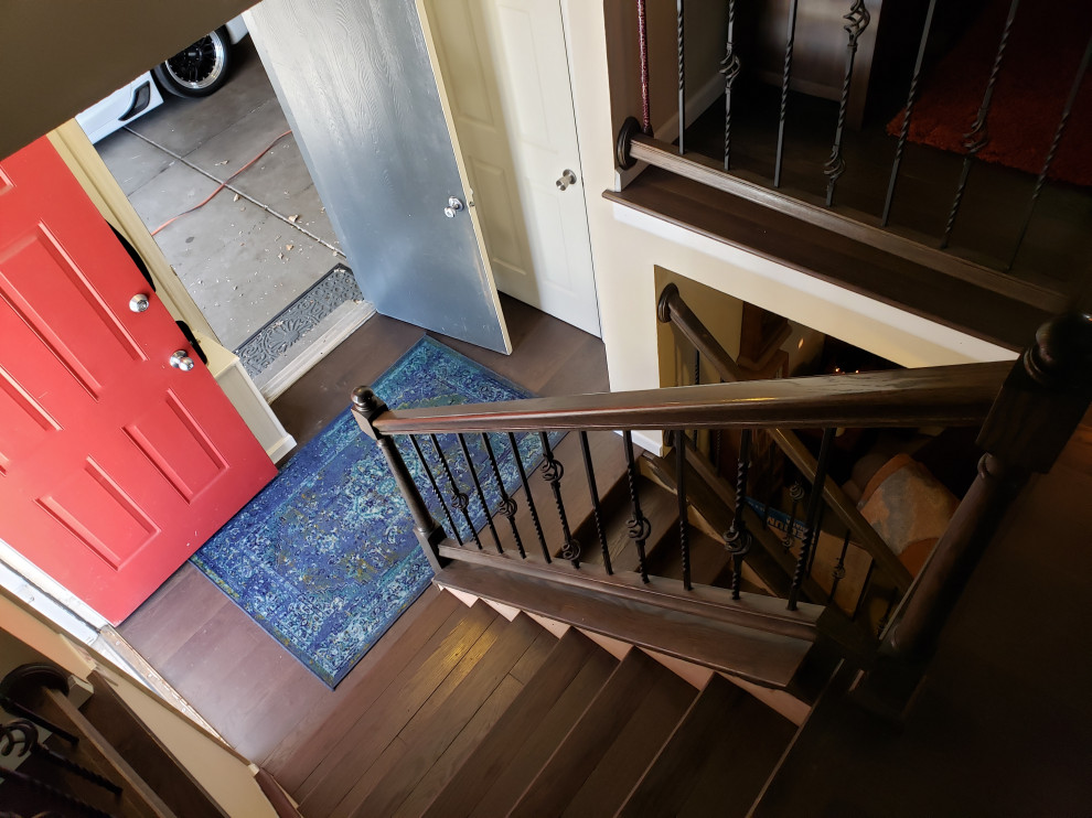 Classic Iron Balusters & Dark Wood Staircase Transformation