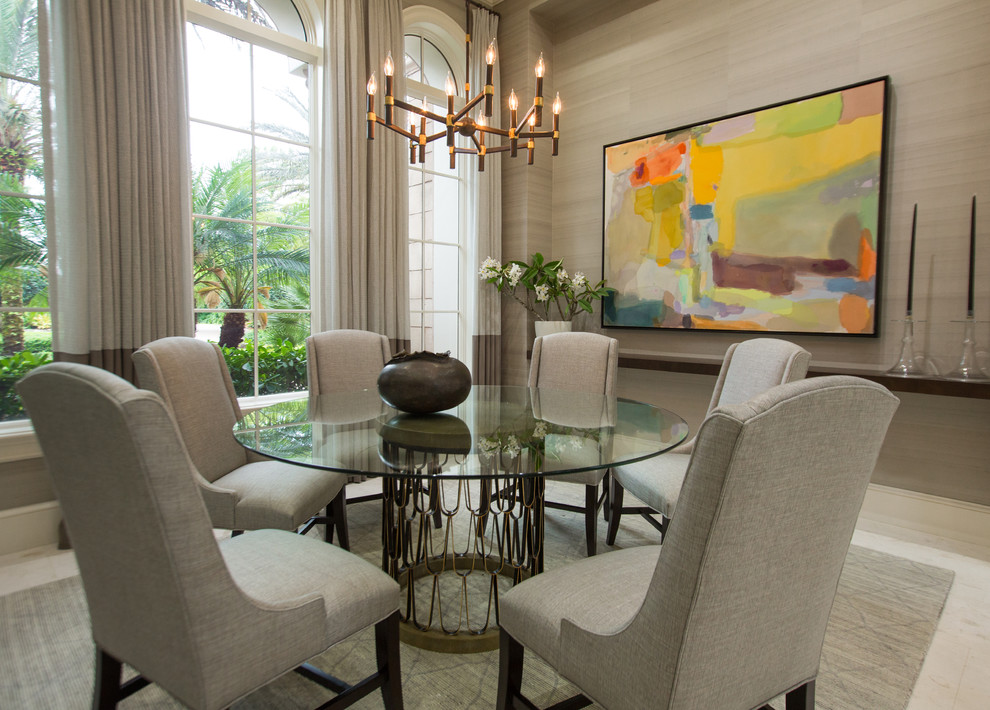 Photo of a large transitional separate dining room in Tampa with grey walls, limestone floors and beige floor.