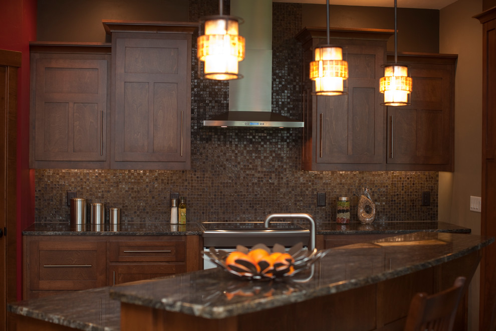 Inspiration for a mid-sized transitional l-shaped open concept kitchen remodel with granite countertops, brown backsplash, stainless steel appliances, brown walls and an island