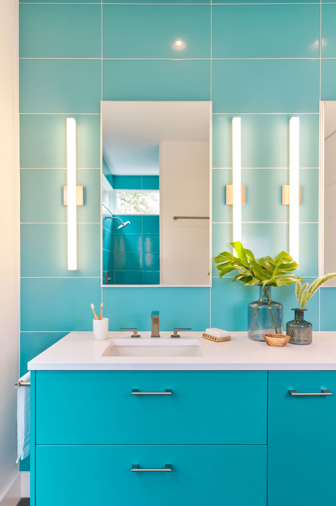 Example of a mid-sized trendy master blue tile double-sink bathroom design in Austin with flat-panel cabinets, blue cabinets, white countertops and a floating vanity