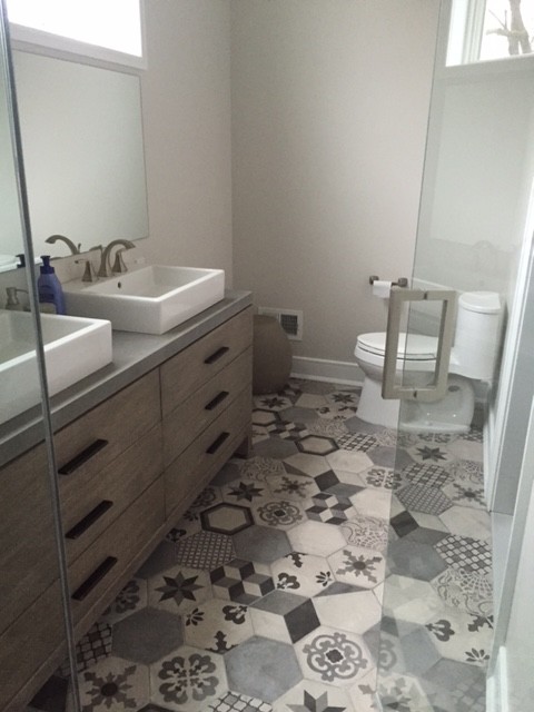 Contemporary master bathroom in Philadelphia with gray tile and porcelain tile.