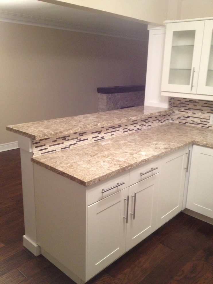 Trendy kitchen photo with concrete countertops