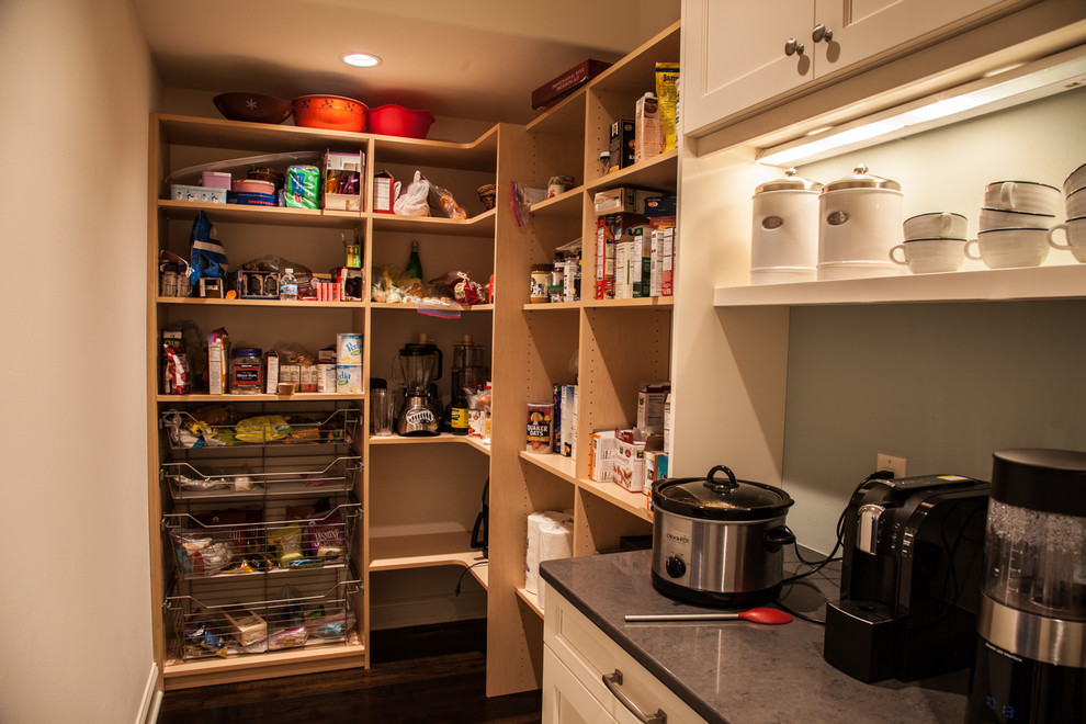 Example of a transitional dark wood floor and brown floor open concept kitchen design with an undermount sink, shaker cabinets, white cabinets, granite countertops, beige backsplash, subway tile backsplash, stainless steel appliances and an island