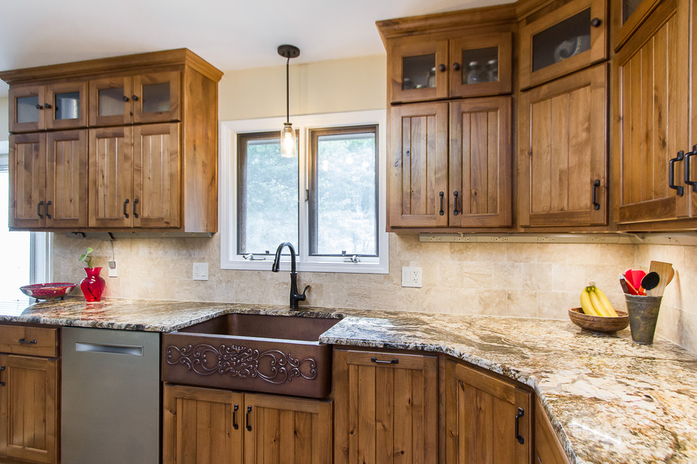 Inspiration for a large rustic light wood floor eat-in kitchen remodel with a farmhouse sink, light wood cabinets, granite countertops, beige backsplash, glass tile backsplash, stainless steel appliances and beige countertops