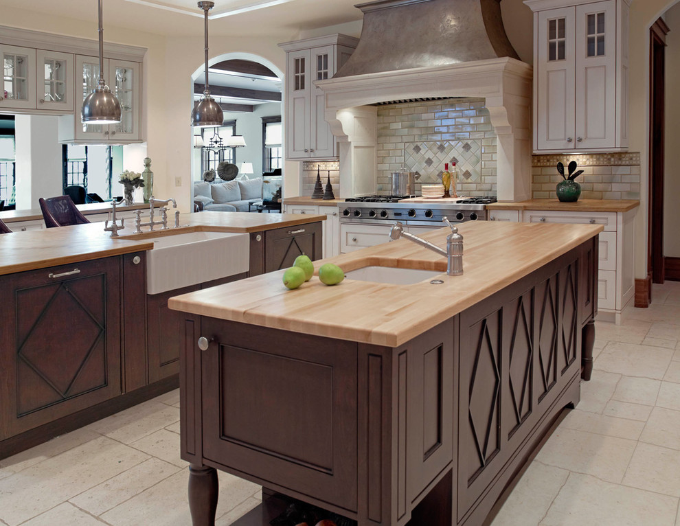 Design ideas for a transitional kitchen in Denver with a farmhouse sink and wood benchtops.