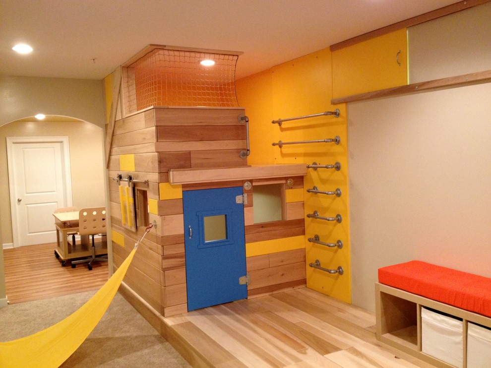 Photo of a large eclectic kids' playroom for boys and kids 4-10 years old in Baltimore with beige walls and medium hardwood floors.