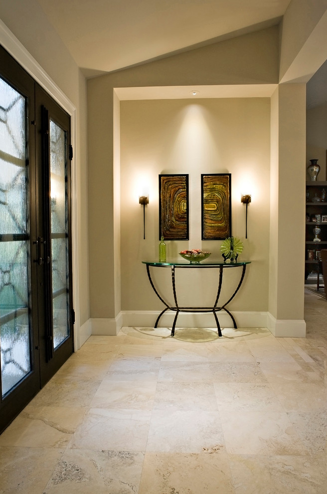 This is an example of a mid-sized contemporary front door in Miami with beige walls, marble floors, a double front door, a metal front door and beige floor.