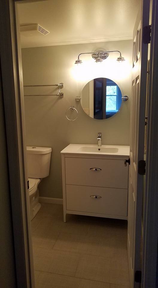 Alcove bathtub - mid-sized transitional 3/4 white tile and subway tile porcelain tile and beige floor alcove bathtub idea with flat-panel cabinets, white cabinets, a two-piece toilet, beige walls, an integrated sink, solid surface countertops and white countertops