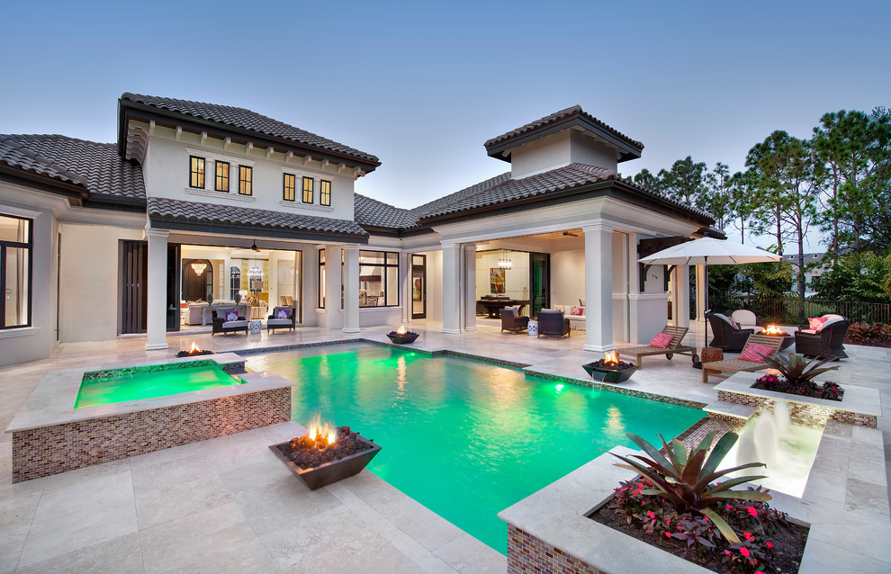 This is an example of a large transitional backyard custom-shaped pool in Tampa.