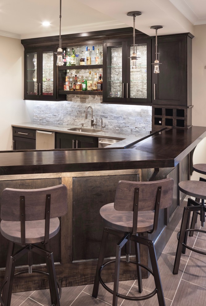Inspiration for a large transitional look-out porcelain tile and brown floor home bar remodel in Chicago with beige walls and no fireplace