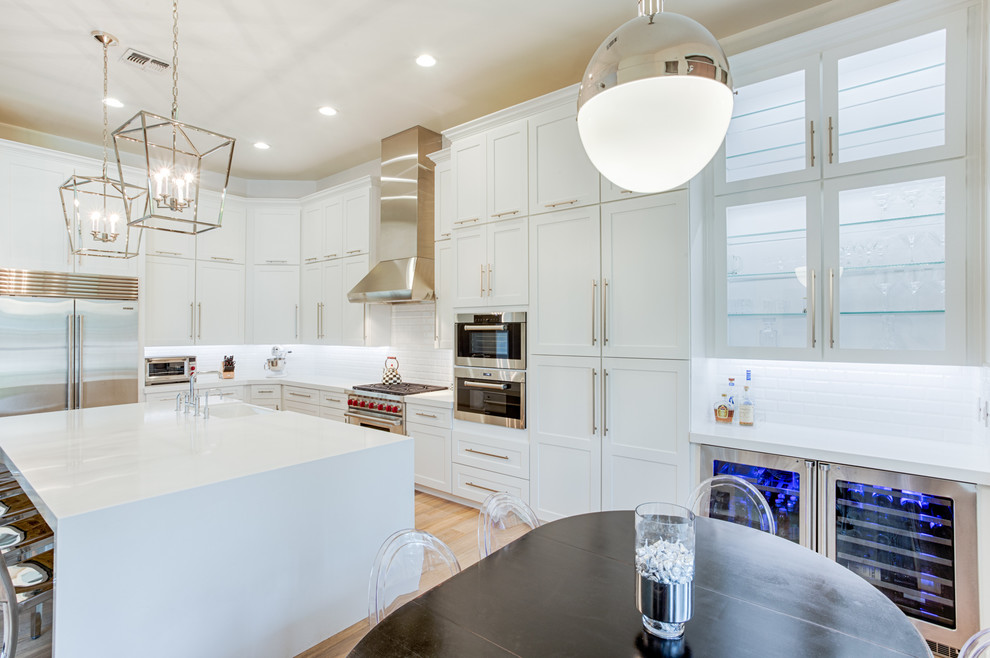 Open concept kitchen - large transitional galley open concept kitchen idea in Phoenix with shaker cabinets and an island