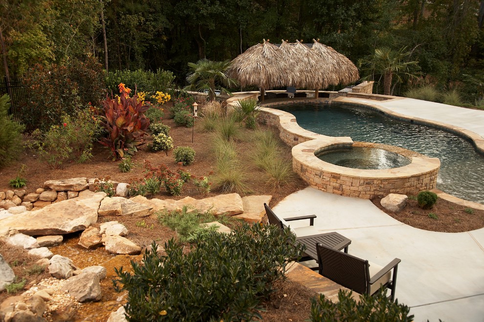 Photo of a tropical backyard xeriscape in Atlanta.