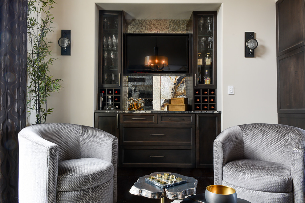Design ideas for a mid-sized contemporary home bar in Edmonton with dark wood cabinets, granite benchtops, mirror splashback, dark hardwood floors, brown floor and black benchtop.
