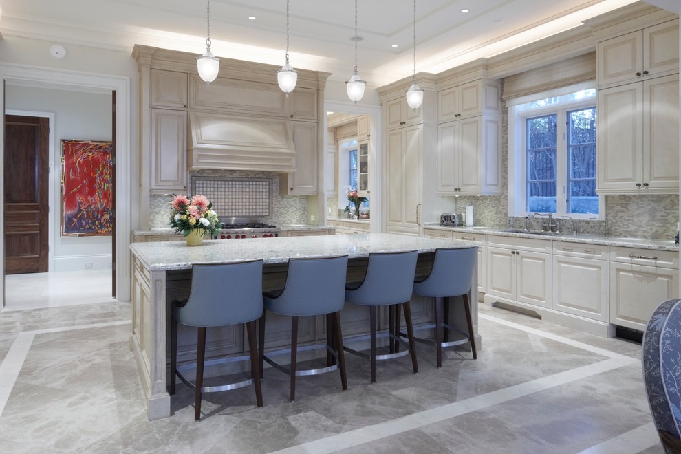 Inspiration for a large traditional l-shaped open plan kitchen in Toronto with an undermount sink, raised-panel cabinets, distressed cabinets, grey splashback, glass tile splashback, stainless steel appliances, marble floors and with island.