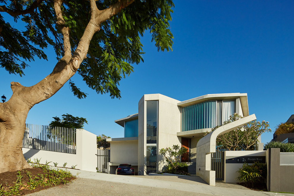 Large contemporary three-storey white house exterior in Perth with stone veneer and a flat roof.