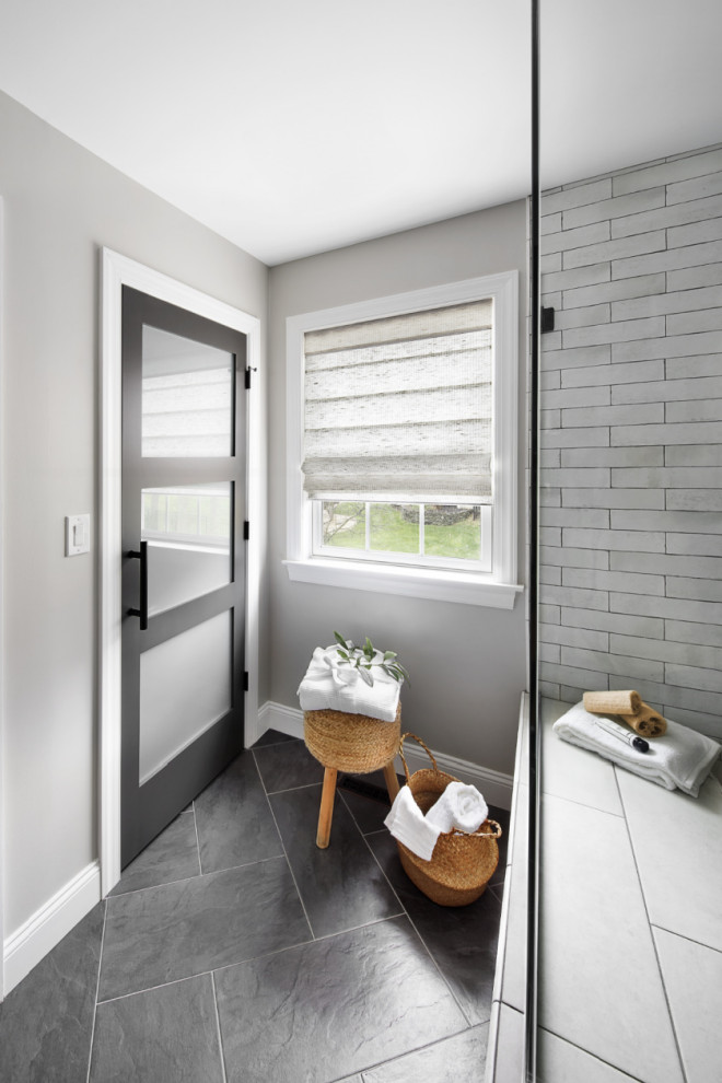 Inspiration for a medium sized rural ensuite bathroom in New York with recessed-panel cabinets, light wood cabinets, white tiles, ceramic tiles, grey walls, ceramic flooring, a submerged sink, engineered stone worktops, grey floors, white worktops, a shower bench, double sinks and a freestanding vanity unit.
