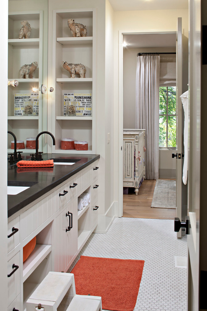 Inspiration for a mid-sized country kids bathroom in Calgary with a drop-in sink, white cabinets, concrete benchtops, white tile, ceramic tile, beige walls and ceramic floors.