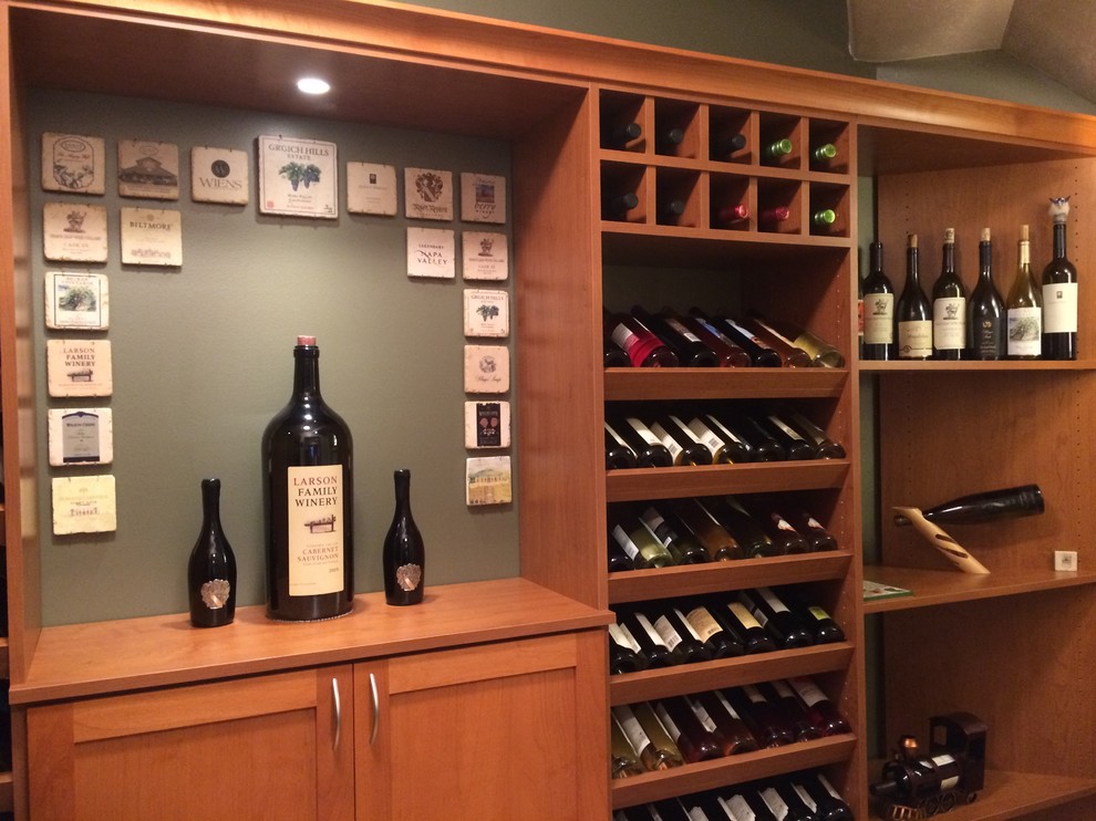 Photo of a small transitional wine cellar in Salt Lake City with laminate floors and display racks.
