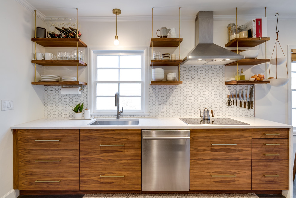 Small minimalist single-wall concrete floor and gray floor eat-in kitchen photo in Portland with an undermount sink, flat-panel cabinets, dark wood cabinets, concrete countertops, white backsplash, ceramic backsplash, stainless steel appliances, no island and white countertops