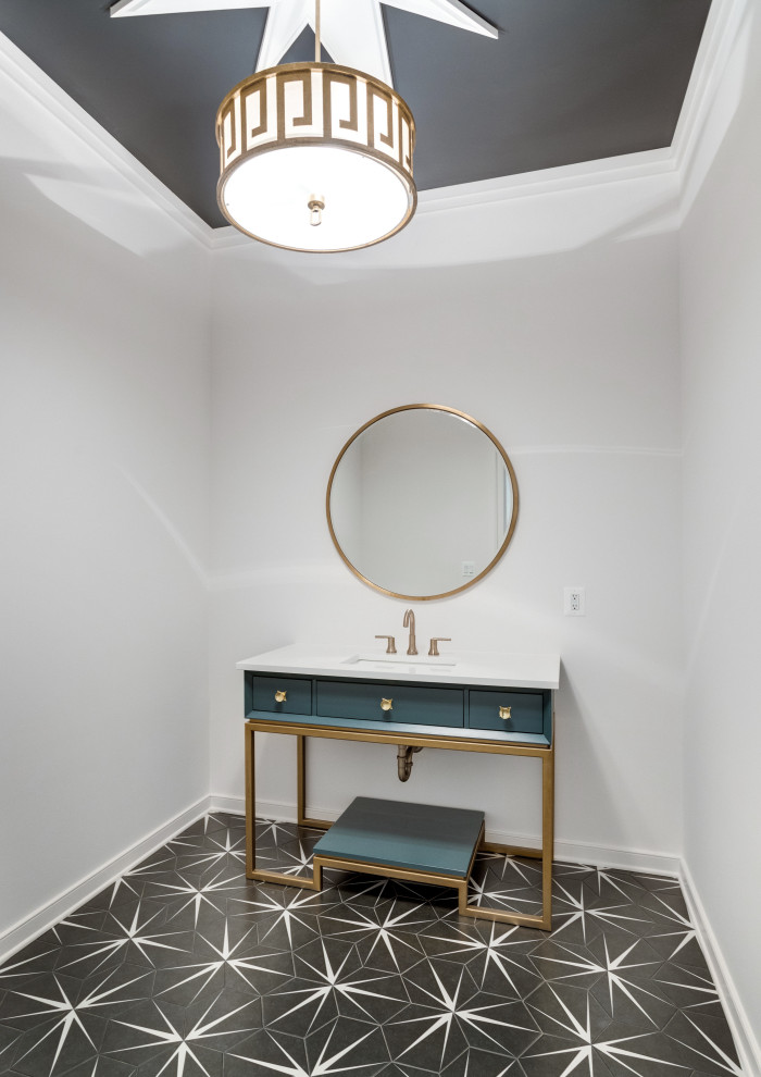 Country powder room in DC Metro with furniture-like cabinets, turquoise cabinets, white walls, ceramic floors, an undermount sink, solid surface benchtops, black floor, white benchtops and a freestanding vanity.