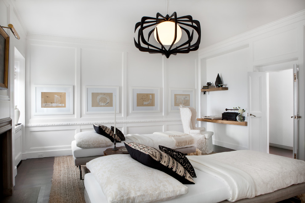 Photo of a large country guest bedroom in Chicago with white walls, dark hardwood floors and no fireplace.