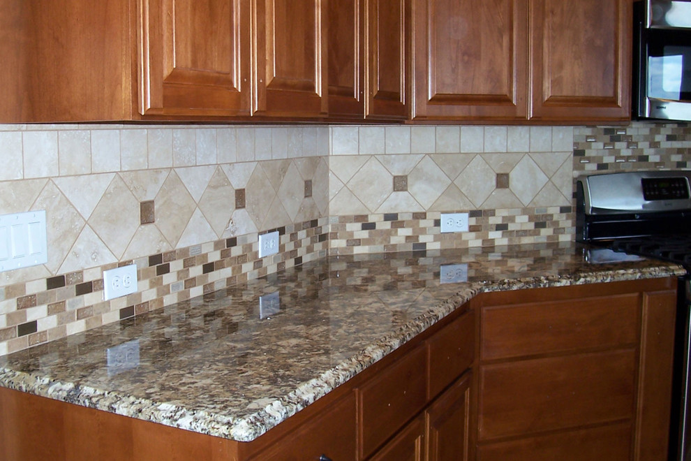 Kitchen - mid-sized transitional l-shaped kitchen idea in Phoenix with raised-panel cabinets, medium tone wood cabinets, granite countertops, multicolored backsplash, ceramic backsplash and stainless steel appliances