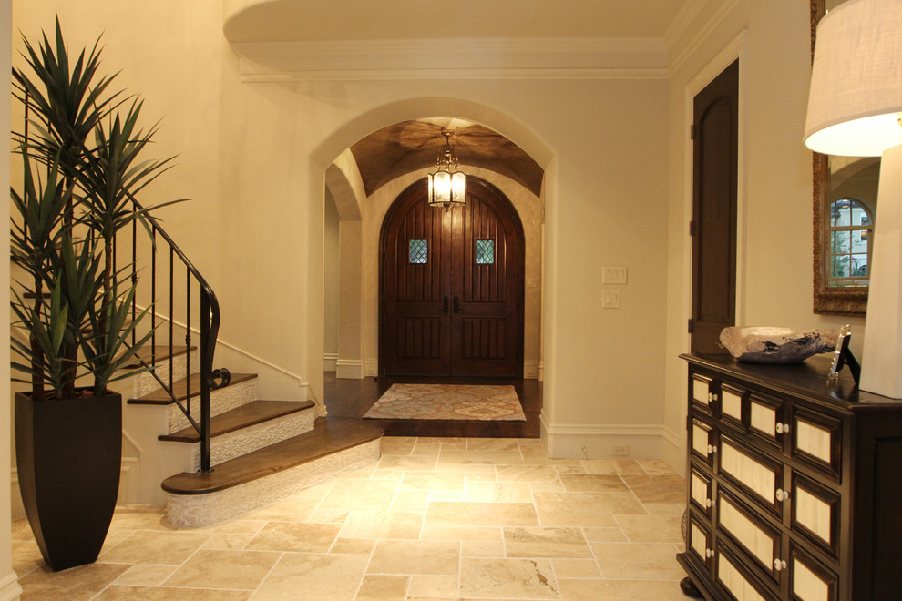 Photo of a mid-sized traditional foyer in Houston with white walls and a double front door.