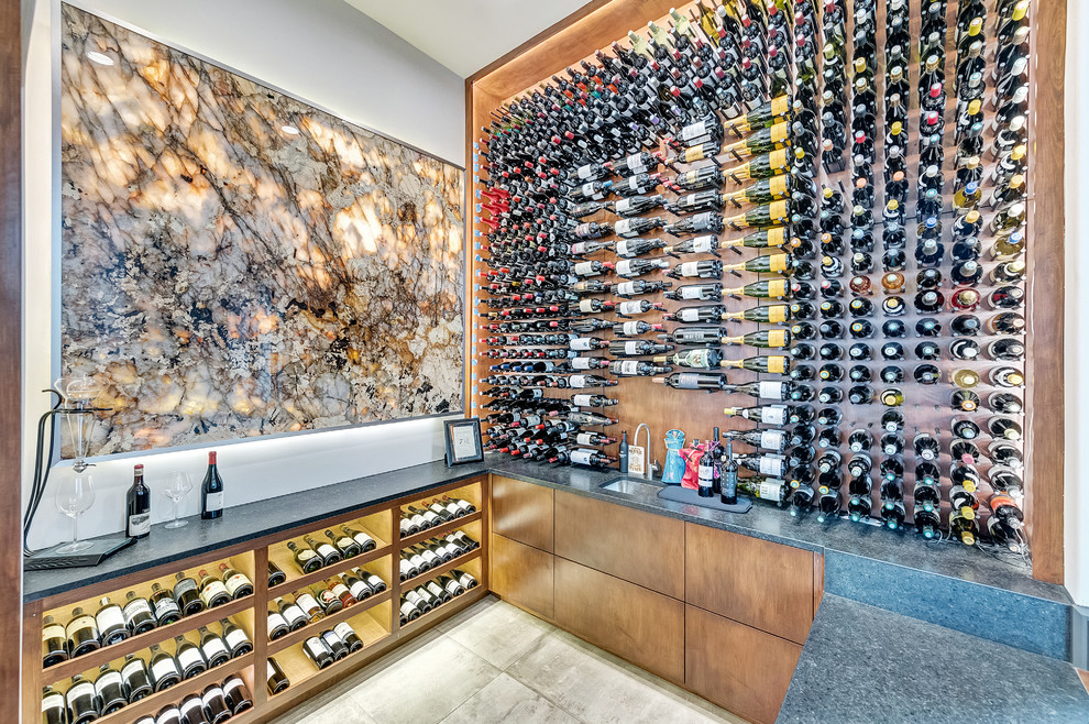 This is an example of an expansive contemporary wine cellar in Orange County with medium hardwood floors and brown floor.