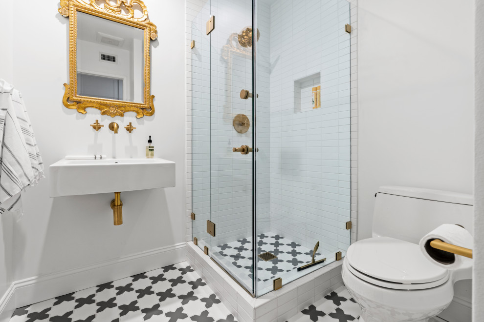 Inspiration for a small country 3/4 bathroom in Los Angeles with a corner shower, a two-piece toilet, white tile, cement tile, white walls, cement tiles, a pedestal sink, grey floor, a hinged shower door, a single vanity and a freestanding vanity.