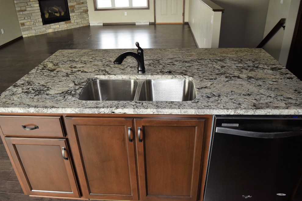 Home design - rustic home design idea with white cabinets, stainless steel appliances and an island
