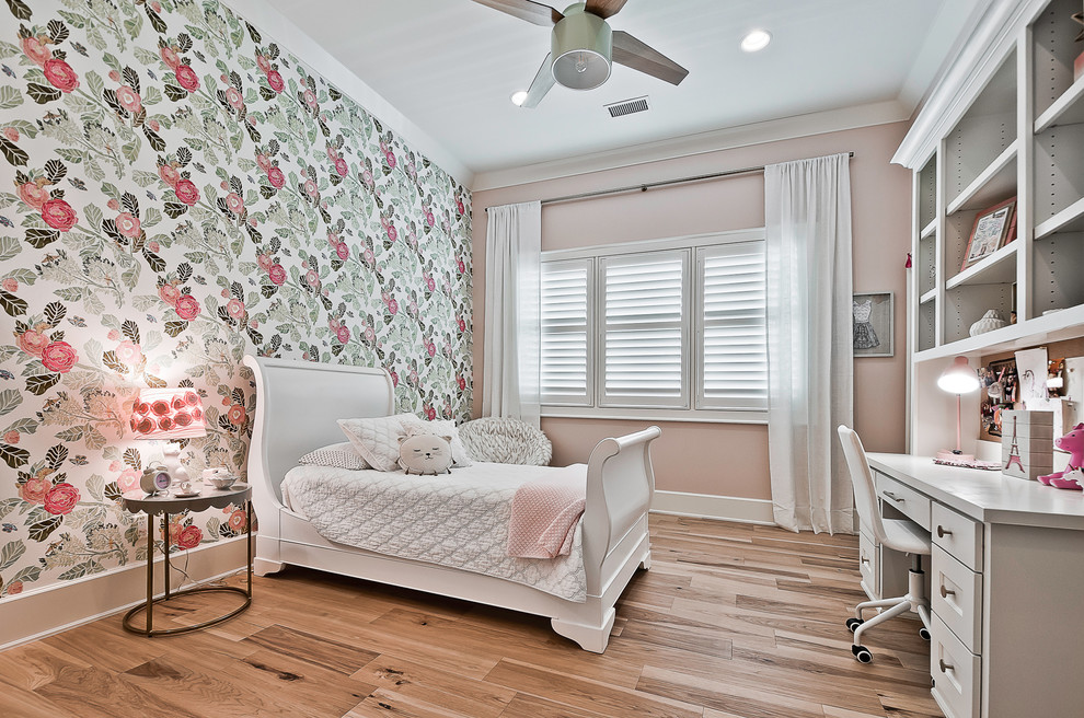 Design ideas for a large arts and crafts guest bedroom in Other with pink walls, light hardwood floors and brown floor.