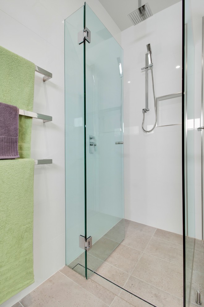 Design ideas for a large contemporary 3/4 bathroom in Adelaide with a freestanding tub, a one-piece toilet, beige tile, ceramic tile, beige walls and ceramic floors.