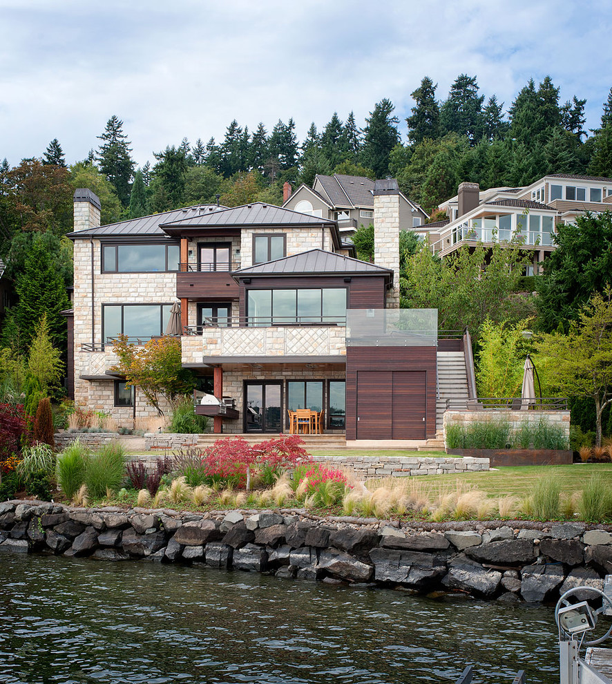 Photo of a contemporary exterior in Seattle with stone veneer.