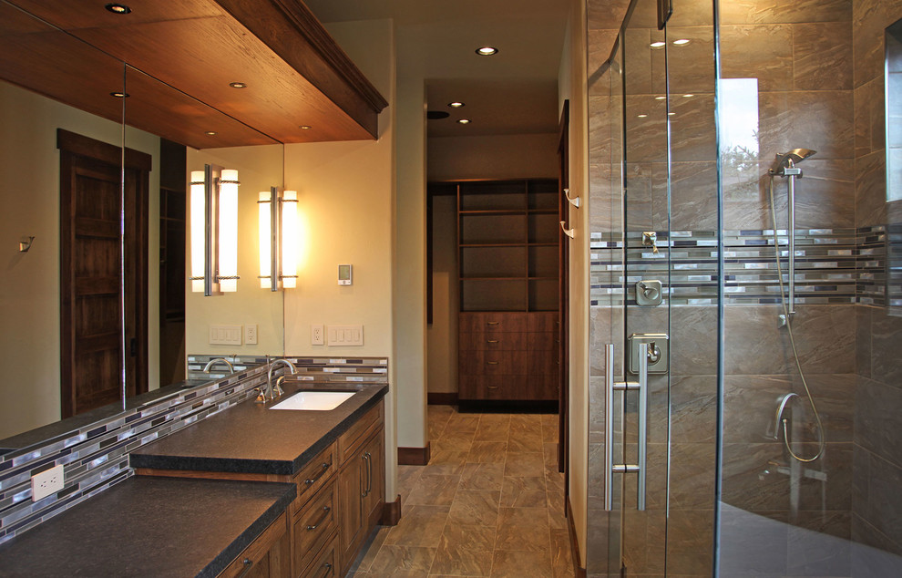 Example of a mountain style bathroom design with beige walls and a drop-in sink