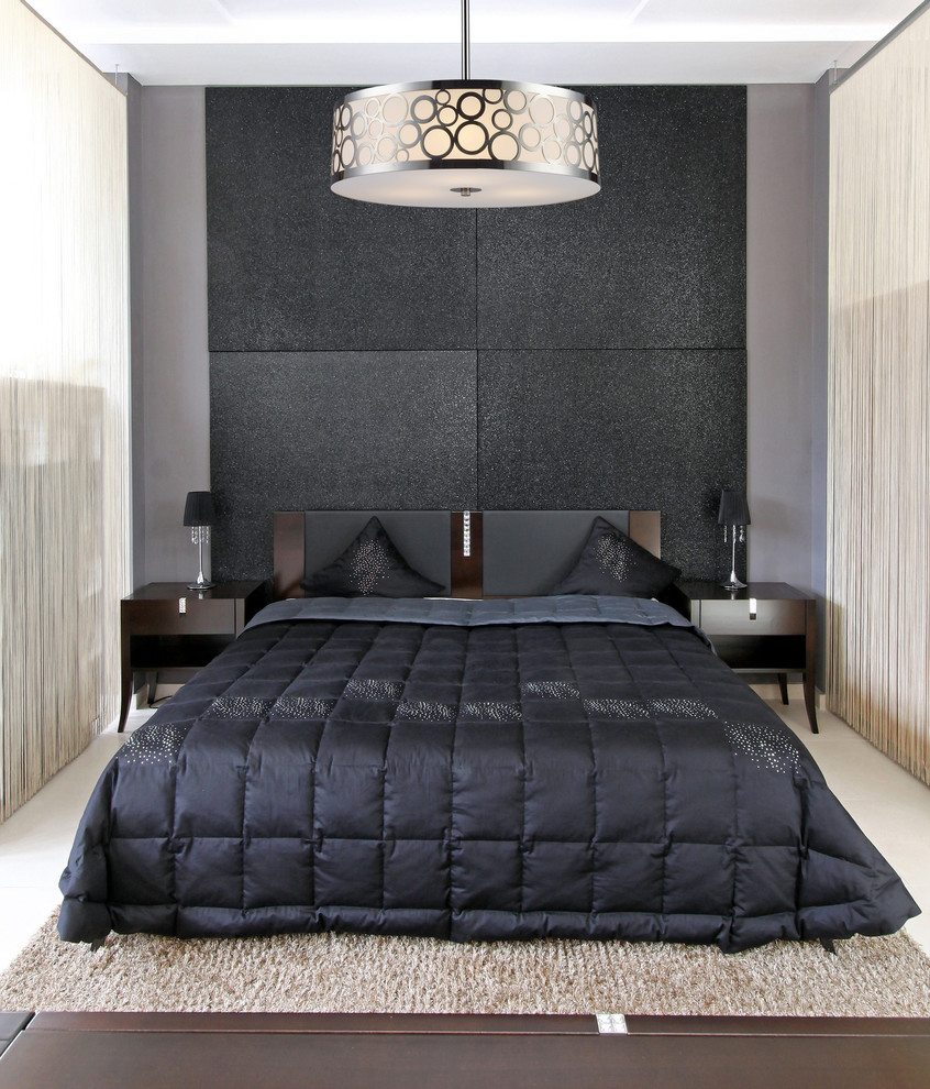Photo of a small contemporary guest bedroom in New York with black walls and marble floors.